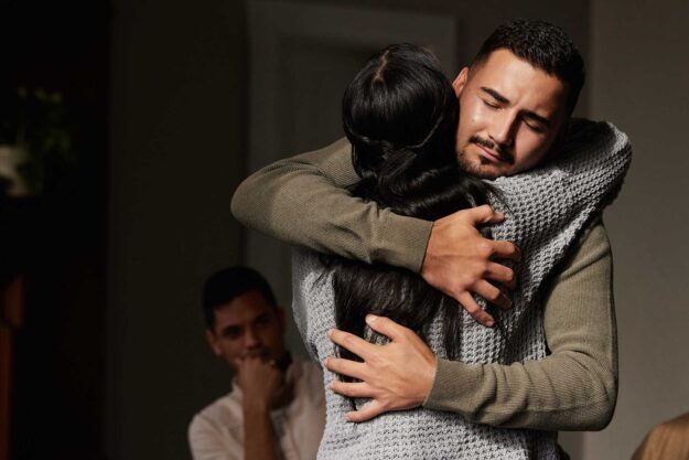 Why Group Therapy Is Important for Recovery a couple hugs over group therapy for recovery